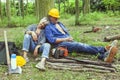 Couple of expert woodsmen taking a break