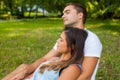 Couple fall asleep while picnic in park.