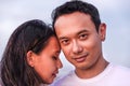 Couple and family concept -close up portrait of young malaysian couple in love outdoor Royalty Free Stock Photo