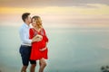 Couple family traveling together on cliff edge in Norway man and woman lifestyle concept summer vacations outdoor aerial Royalty Free Stock Photo