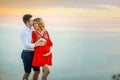 Couple family traveling together on cliff edge in Norway man and woman lifestyle concept summer vacations outdoor aerial Royalty Free Stock Photo