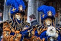 Couple with fantasy Carnival ÃÅÃÂ°sk and a dog at Carnival of Venice