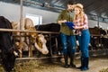 couple of farmers looking at clipboard