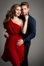 Couple Fashion Beauty, Beautiful Woman in Red Dress and Elegant Man Royalty Free Stock Photo