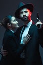 Couple, fashion or gun on dark studio background in secret spy, isolated mafia safety or crime lord security. Gangster Royalty Free Stock Photo