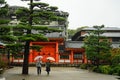 Couple fashionable dressed youth tourists walking with camera to temple Kyoto