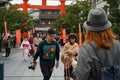Couple fashionable dressed youth tourists walking with camera to temple Kyoto