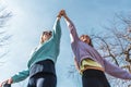 couple of female athletes having fun while climbing on sport metal structure outdoors Royalty Free Stock Photo