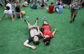 Couple of festival goers laying on ground enjoying sonar festival