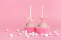 couple festive icing cake pops and marshmallows over pink background, concept of Valentines day Royalty Free Stock Photo