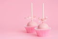 Couple festive icing cake pops over pink background, concept of Royalty Free Stock Photo