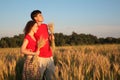 Couple in field with wheat in hands Royalty Free Stock Photo