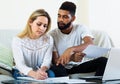 Couple filling papers for mortgage