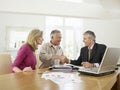 Couple With Financial Advisor At Table Royalty Free Stock Photo