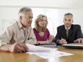 Couple With Financial Advisor At Table Royalty Free Stock Photo