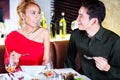 Couple fine dining in fancy restaurant Royalty Free Stock Photo