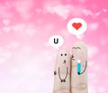 Couple finger holding flower and chat box on pink heart bokeh