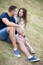 Couple flirting on lawn Royalty Free Stock Photo