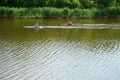 A couple floating on kayaks along the river against the current Royalty Free Stock Photo