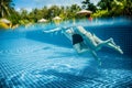 Couple floating in the pool on holiday Royalty Free Stock Photo