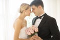 Couple With Flower Bouquet Rubbing Noses Royalty Free Stock Photo