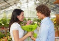 Couple in flower nursery Royalty Free Stock Photo