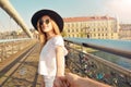 Couple follow me in Poland. Woman wanting her man to follow her in vacation or honeymoon. Attractive young woman in hat