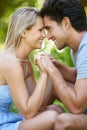 Couple, forehead touch and smile in park with love and commitment in healthy relationship. People on date outdoor