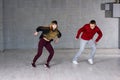 Couple of freestyle dancers in motion.