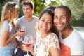 Couple With Friends Drinking Wine And Relaxing Outdoors Royalty Free Stock Photo