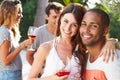 Couple With Friends Drinking Wine And Relaxing Outdoors Royalty Free Stock Photo