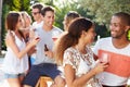 Couple With Friends Drinking Wine And Relaxing Outdoors Royalty Free Stock Photo