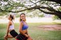 Couple friends girl warming up outdoor,Sporty young woman doing stretching at public park in the morning Royalty Free Stock Photo