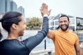 Couple of friends, laughing and high five for sports, success and team support in city. Happy athletes, fitness Royalty Free Stock Photo