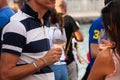 A Couple of friends male and female holding a glass of Prosecco