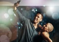 Couple of friends, phone or selfie on party dance floor in nightclub event, bokeh disco or birthday celebration. Smile Royalty Free Stock Photo