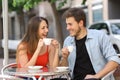 Couple or friends talking and drinking in a restaurant