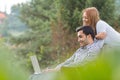 Couple or friends using laptop