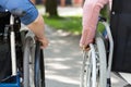 Couple of friends on a wheelchair