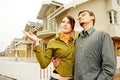 Couple in front of family house