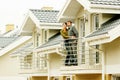 Couple in front of family house