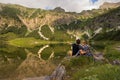 Couple in front of lake / Couple in love standing in front of mountains and lake from Bavaria , Germany Royalty Free Stock Photo