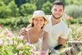 Couple gardeners planting plants