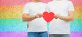 Couple with gay pride rainbow wristbands and heart Royalty Free Stock Photo