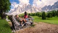 Couple at Geisler Alm, Dolomites Italy, hiking in the mountains of Val Di Funes in Italian Dolomites