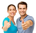 Couple Gesturing Thumbs Up Over White Background
