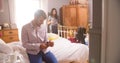 Couple Getting Dressed For Work In Bedroom Royalty Free Stock Photo