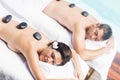Couple getting a hot stone massage Royalty Free Stock Photo