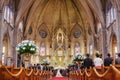 Couple getting married in a beautiful gothic church