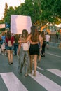 Couple of girls walk hugging in the Manifestacion de Murcia by the weather, September 27, 2019. Spain